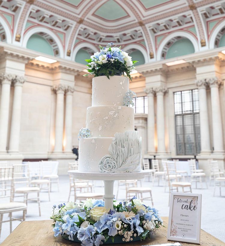 Lush tones of blue, white, silver and delicate floral