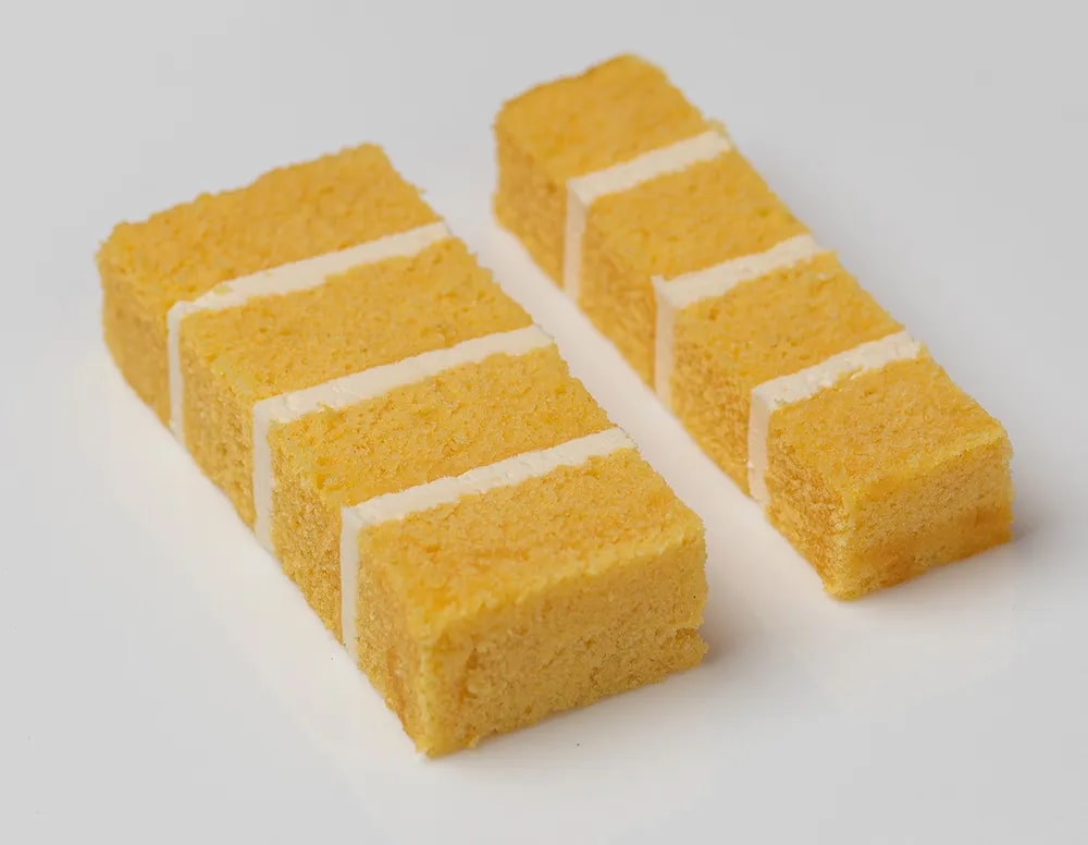Lemon yellow moist sponge, layered with lemon curd & elderflower buttercream.